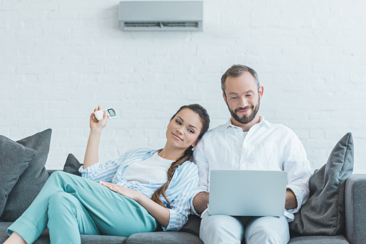 couple at home with ac system